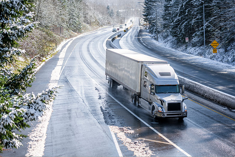 large fleet truck driving on winter roads 